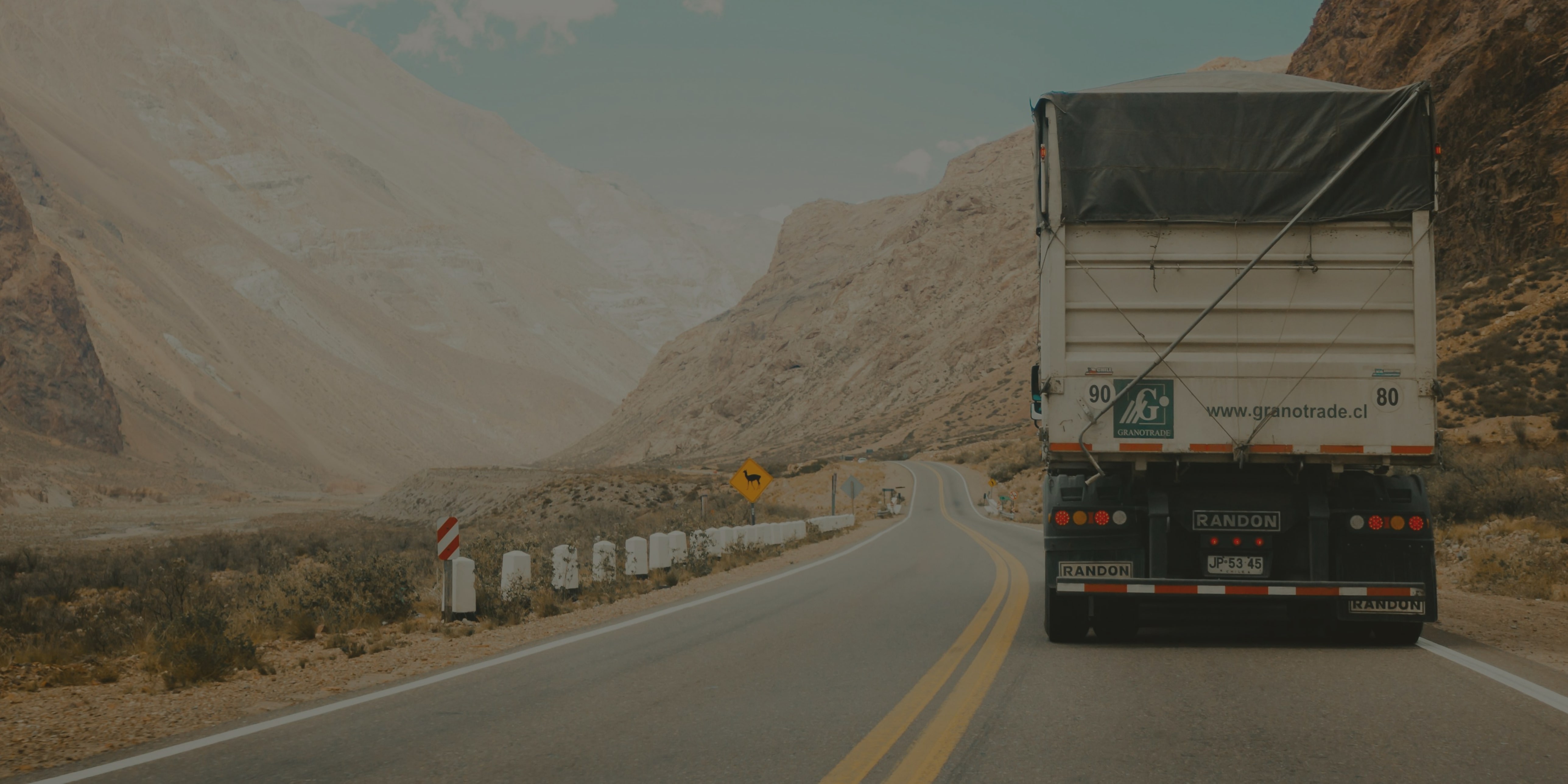 Truck loaded on a highway.